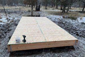 Snow falling on the deck